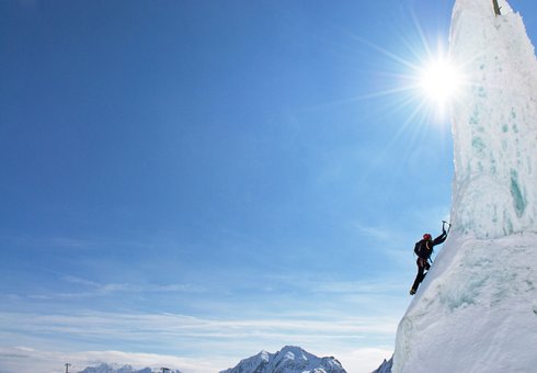 Ice climber on the Gamsgarten ice climbing tower
